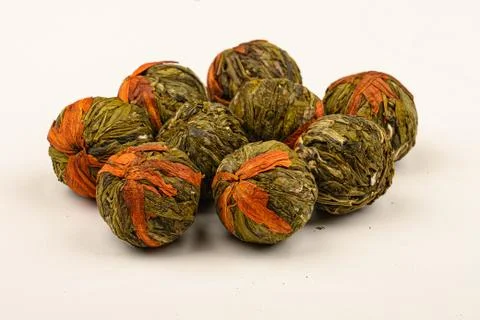 A ball of flower tea on a white background. Close up. Stock Photos