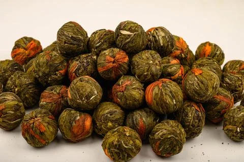 A ball of flower tea on a white background. Close up. Stock Photos