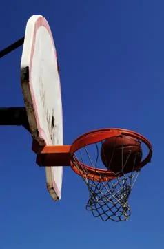 A ball going into the hoop Stock Photos