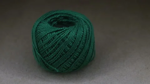 Ball of green yarn wool on rotating table Stock Footage 88012530