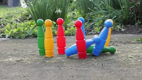 Ball hits and knocks down kids bowling pins slow motion 2026 Stock Footage 332725328