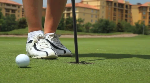 Ball into hole on green Stock Footage 36762660