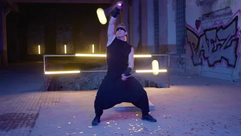 Ball Juggler - performs in an abandoned place at night 動画素材 281292341