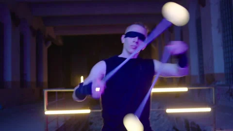 Ball Juggler - performs in an abandoned place at night Stock Footage 281292354