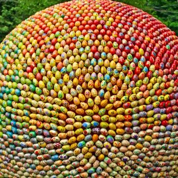A ball made from lot multicolored easter eggs. Stock Photos