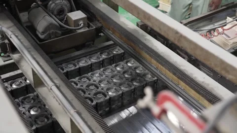 Ball Molds Passing Through Machine With Shallow Depth of Field Vídeo Stock 339736672
