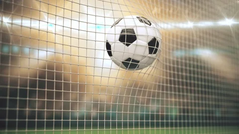 A ball in the rays of light flies into the goal in slow motion in the rays of Stock Footage 126713964
