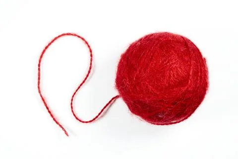 A ball of red woolen threads on a white background Stock Photos
