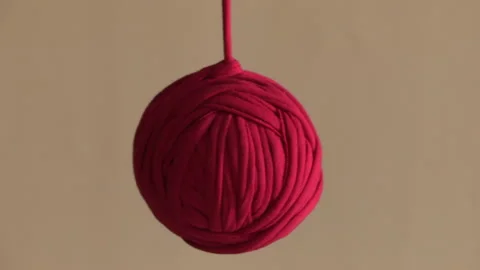 Ball of red yarn Stock Footage 332084197