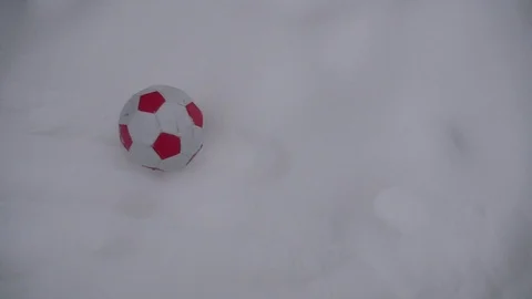Ball rolling on snow slow motion Stock Footage 87479179