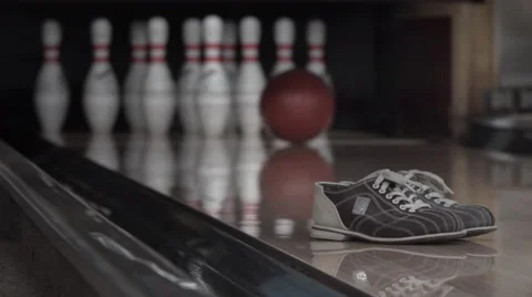 Ball rolls down a bowling lane for a strike. Slow motion Stock Footage 61440552