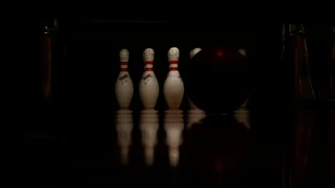 Ball rolls down a bowling lane for a strike Stock Footage 70641174