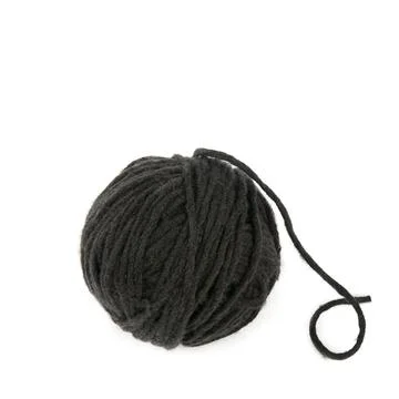 Ball of soft black wool thread isolated on plain white background in square.. Stock Photos