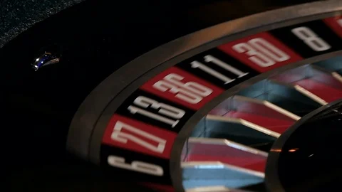 A ball spins in slow motion on a roulette table Stock Footage 112006186