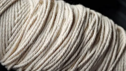 Ball of string extreme close up rotating very slowly stock footage Stock Footage 130578848