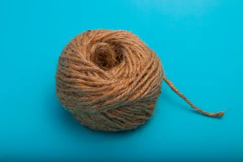 Ball of string isolated on a blue background Foto stock