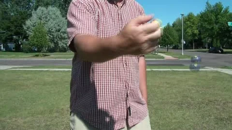 Ball on String Swinging at Camera Video stock 12571086