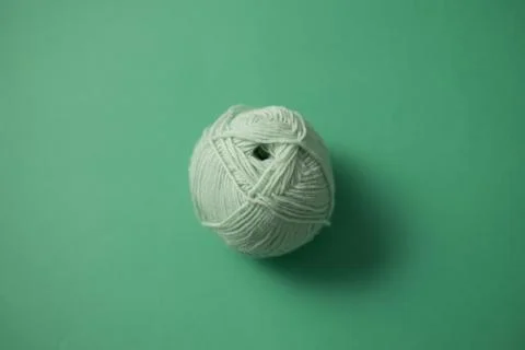 Ball of String On Top of Green Surface Foto stock