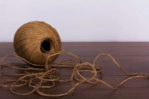 Ball of string on a wooden background Stock Photos