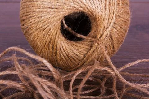 Ball of string on a wooden background Stock Photos