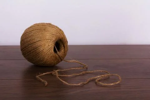 Ball of string on a wooden background Stock Photos
