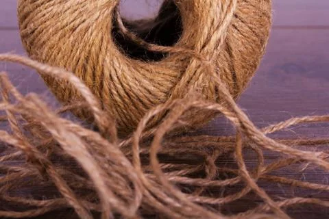 Ball of string on a wooden background Stock Photos