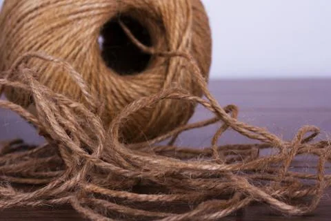 Ball of string on a wooden background Foto stock