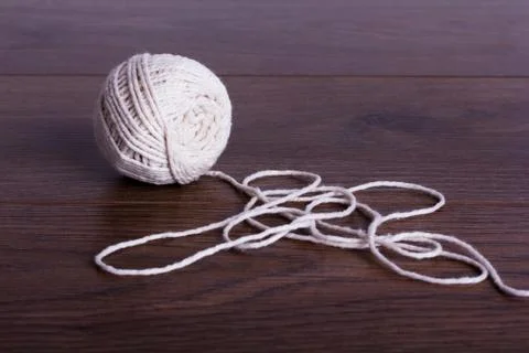 Ball of string on a wooden background Stock Photos