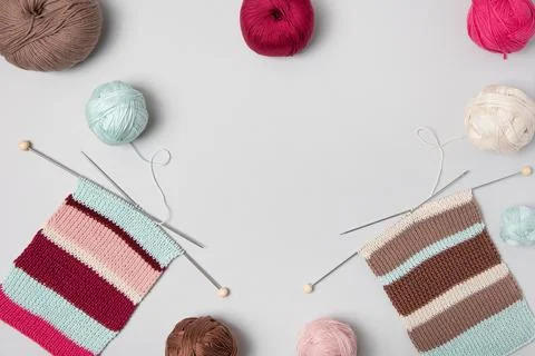 Ball of thread with knitting needles and fabric Stock Photos