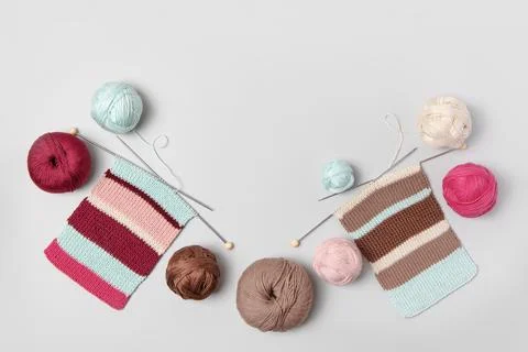 Ball of thread with knitting needles and fabric Stock Photos