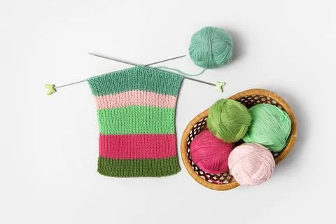 Ball of thread with knitting needles and knitted fabric Stock Photos