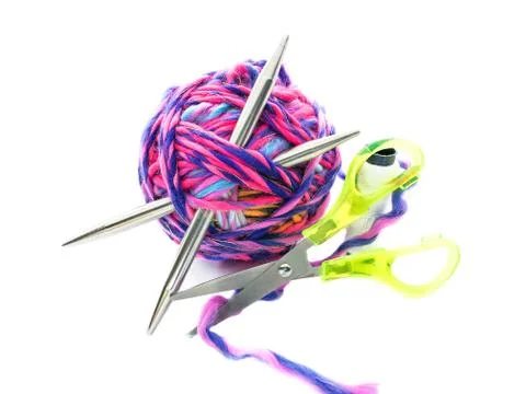 Ball of thread with knitting needles isolated on a white background. Stock Photos