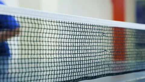 The ball through the table tennis net Stock Footage 232114756