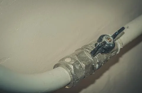 Ball valve blocking the water of the heating system of the house. Selective Stock Photos