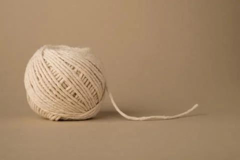 Ball of White Wool with Dangling End Stock Photos