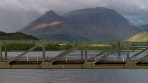 Ballachulish Bridge against the dramatic, cloud-capped mountains of Glencoe. Stock Footage 335680770