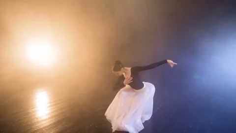 A ballerina bows and gets up on a stage. Stock Footage