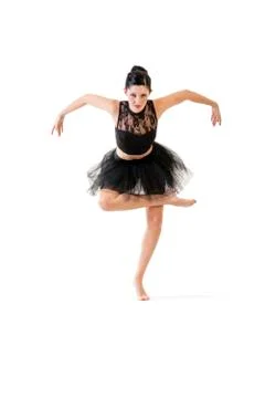 Ballerina dancing and posing in studio for a performance wearing black Stock Photos