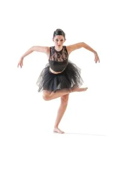 Ballerina dancing and posing in studio for a performance wearing black Foto stock