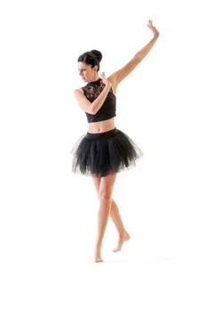 Ballerina dancing and posing in studio for a performance wearing black Foto stock
