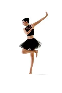 Ballerina dancing and posing in studio for a performance wearing black Stock Photos