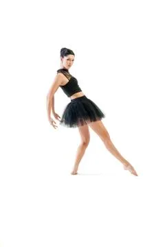 Ballerina dancing and posing in studio for a performance wearing black Stock Photos