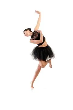 Ballerina dancing and posing in studio for a performance wearing black Stock Photos
