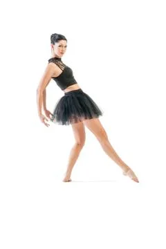 Ballerina dancing and posing in studio for a performance wearing black Stock Photos