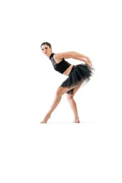 Ballerina dancing and posing in studio for a performance wearing black Foto stock