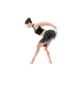Ballerina dancing and posing in studio for a performance wearing black Stock Photos
