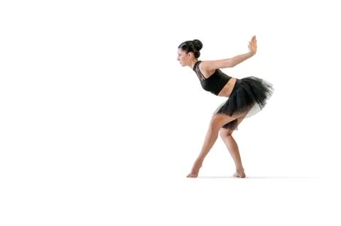 Ballerina dancing and posing in studio for a performance wearing black Foto stock