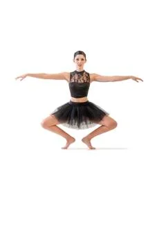 Ballerina dancing and posing in studio for a performance wearing black Stock Photos
