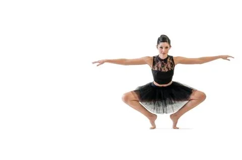 Ballerina dancing and posing in studio for a performance wearing black Stock Photos