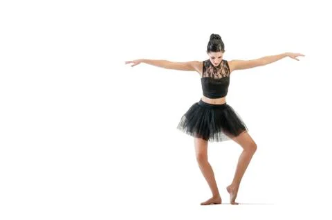 Ballerina dancing and posing in studio for a performance wearing black Foto stock